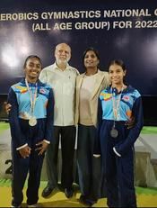 Two Aerial Zone gymnasts with medals at the Aerobic Gymnastics Nationals 2022